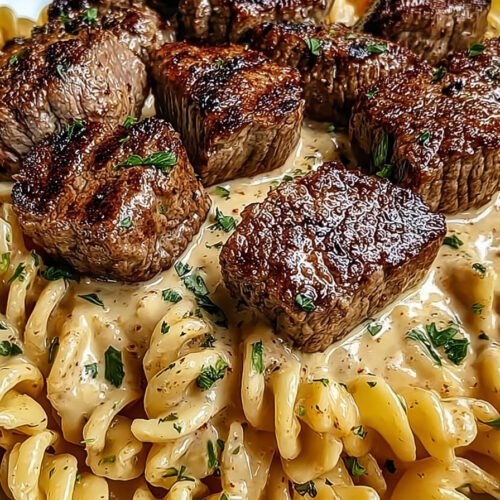 Creamy Garlic Butter Steak Bites with Spicy Cajun Alfredo Twisted Pasta extra recipe photo